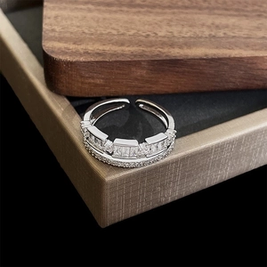 Detail of silver double-layer open ring with rectangular zircon and pave crystals