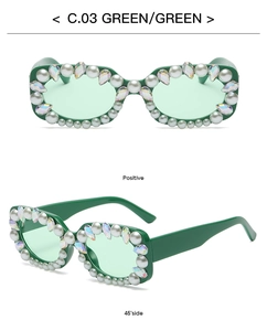 Detail view of square green sunglasses with luxury faux pearls and colorful rhinestones