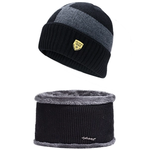 Detail of winter knitted hat and neck warmer set with thick grey fleece lining and logo