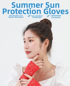 Close-up of red lace fingerless sun protection gloves for women on a white background