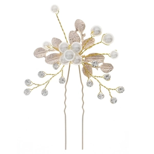 Detailed macro view of handmade bridal hair fork with pearls and rhinestones