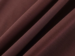 Close-up of deep brown knitted fabric texture on V-neck long sleeve yoga shirt