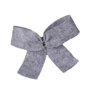 Gray felt Christmas tree bow decoration with central metal buckle on white background