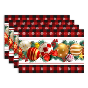 Set of 4 Christmas placemats with red and black plaid patterns and festive snowflake ornaments