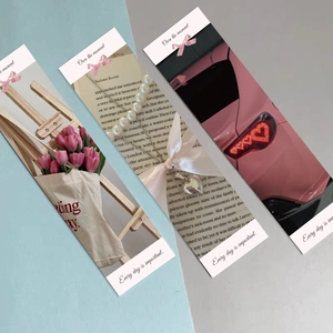 Pink aesthetic paper bookmarks with motivational quotes and artistic still life photography