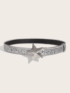Close-up of sparkling silver glitter belt featuring a polished metal star-shaped buckle