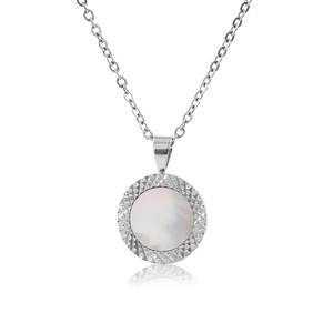 Detailed close-up of a silver necklace with a round mother of pearl pendant and textured frame