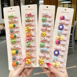 Close-up of colorful cartoon flower and animal hair ties on pink display cards