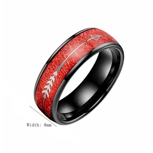 Detail showing 8mm black titanium ring with red fiber inlay and silver arrow pattern