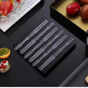 Set of 8 transparent plastic fruit forks with bead handles displayed on a stand
