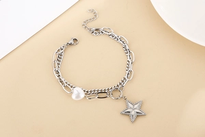 Detail of silver double-layer star and heart pearl pendant bracelet with lobster clasp