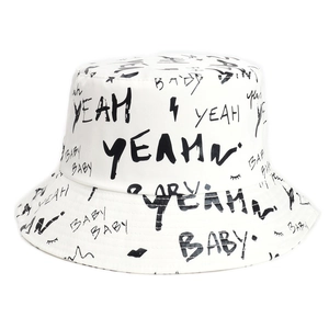 White bucket hat with black graffiti print featuring yeah and baby text patterns