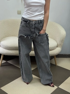 Distressed high-waisted dark gray wide-leg jeans with frayed fringe knee cutouts
