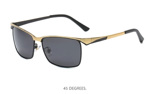 Detail view of polarized sunglasses with black and gold metal frame at a 45-degree angle