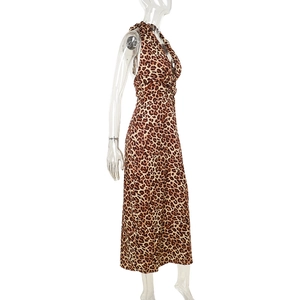 Detailed side view of deep V-neck leopard print halter midi dress on a mannequin