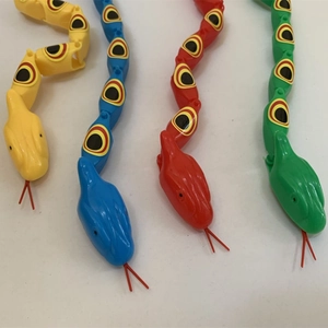 Flexible plastic jointed snakes in yellow, blue, red, and green for kids and prank gifts