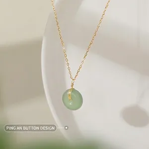 Green Hetian jade Pingan buckle pendant on a gold 18K plated stainless steel chain