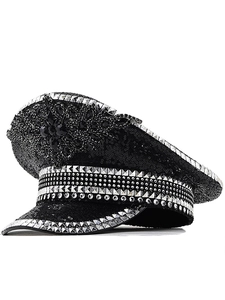 Detail of black sequined captain hat with silver studs and crystal floral embellishment