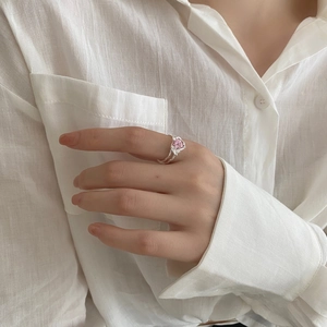 Close-up of S925 silver ring featuring pink heart zircon and irregular textured band
