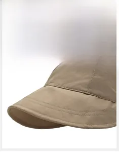 Close-up of khaki sun hat featuring a stiff wide brim with reinforced multi-row stitching