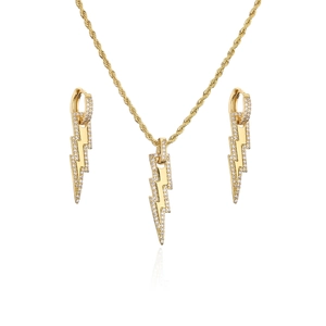 Golden jewelry set with lightning bolt pendants, zircon inlay, necklace and earrings