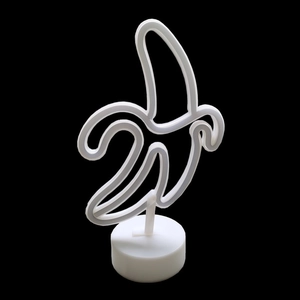 Close-up of banana-shaped LED neon desk lamp with a sturdy white circular base stand
