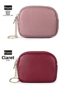 Detail of pink and claret lychee leather coin purses with gold zippers and keychains