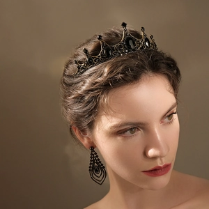 Elegant black rhinestone crown and earring set for Halloween parties on a model
