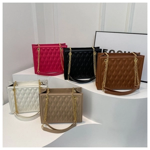 Quilted tote bags set in pink, black, brown and white with gold chain shoulder straps