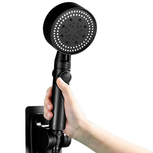 Matte black high-pressure handheld shower head with STOP button and wall-mounted bracket