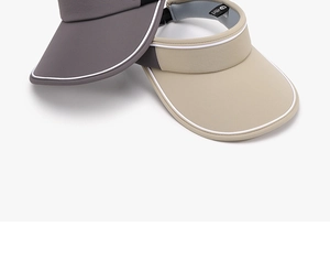 Detail of outdoor running caps showing sweatband, contrast brim and quick-dry fabric