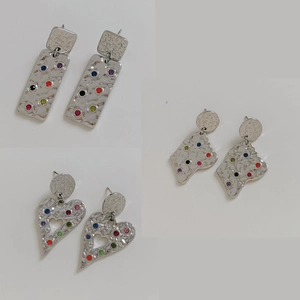 Three pairs of silver 316 stainless steel earrings with hammered texture and colorful crystals