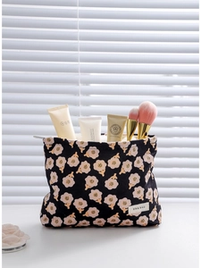 Floral corduroy makeup bag with large capacity, featuring pink flowers and woven label