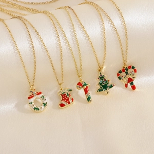 Macro shot of assorted Christmas pendants with colorful enamel and sparkling crystals