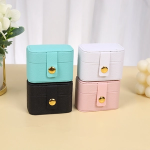 Mini portable PU leather jewelry boxes in four colors with secure gold snap closures