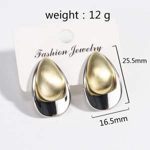 Detail showing two-tone gold and silver teardrop earrings with brushed texture and dimensions