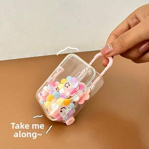 Mini transparent jewelry organizer with pink trolley wheels and smiling plush flowers