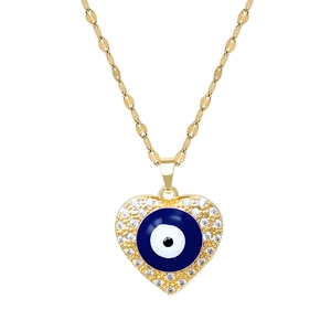 Titanium gold heart necklace with zircon evil eye pendant on a white background