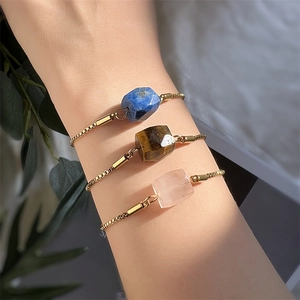 Minimalist gold chain bracelets featuring natural lapis, tiger eye, and rose quartz stones