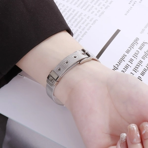 Detailed view of silver mesh watch band bracelet with adjustable buckle on wrist