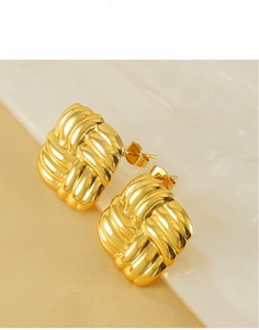 Detail of 18k gold woven knot stud earrings made of high-quality titanium steel