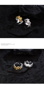 Detail of retro relief pattern and S925 silver hallmark on adjustable open rings