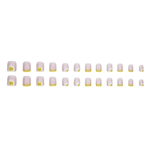 Press-on nails featuring yellow daisies and French tips on a translucent base