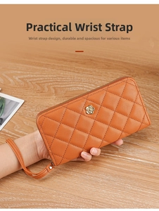 Detail showing the quilted faux leather texture and gold floral logo on a caramel wristlet