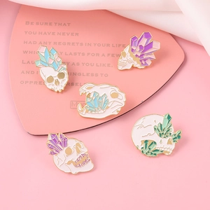 Set of 5 punk skull crystal enamel pins featuring colorful gemstones on a pink background