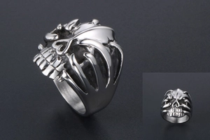 Macro detail of a gothic skull ring in vintage stainless steel with matte silver finish