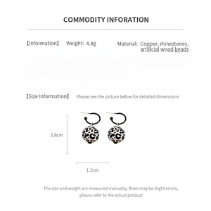 Size and material specification chart for leopard print earrings with rhinestone details