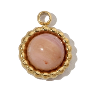 Detail of gold-plated pendant with pink stone and beaded edge craftsmanship