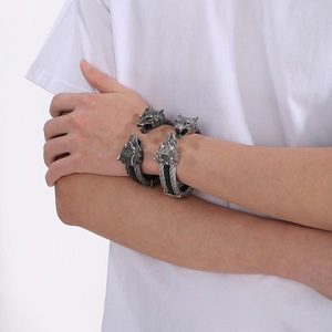 Macro detail of vintage wolf head leather bracelet with twisted wire finish for men