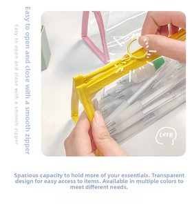 Detail of transparent PVC stationery bag with yellow and pink edges and metal ring zipper
